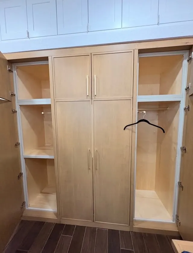 Wardrobe doors open on hanging space and adjustable shelves