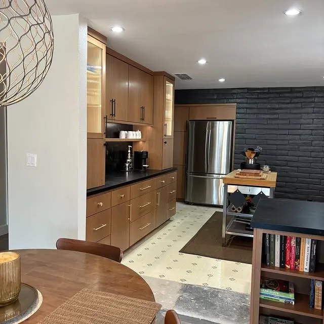 Pecan cabinet run with glass uppers and under-cabinet lighting