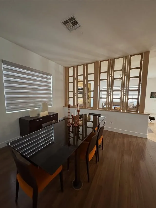 Dining room seen through the white oak divider