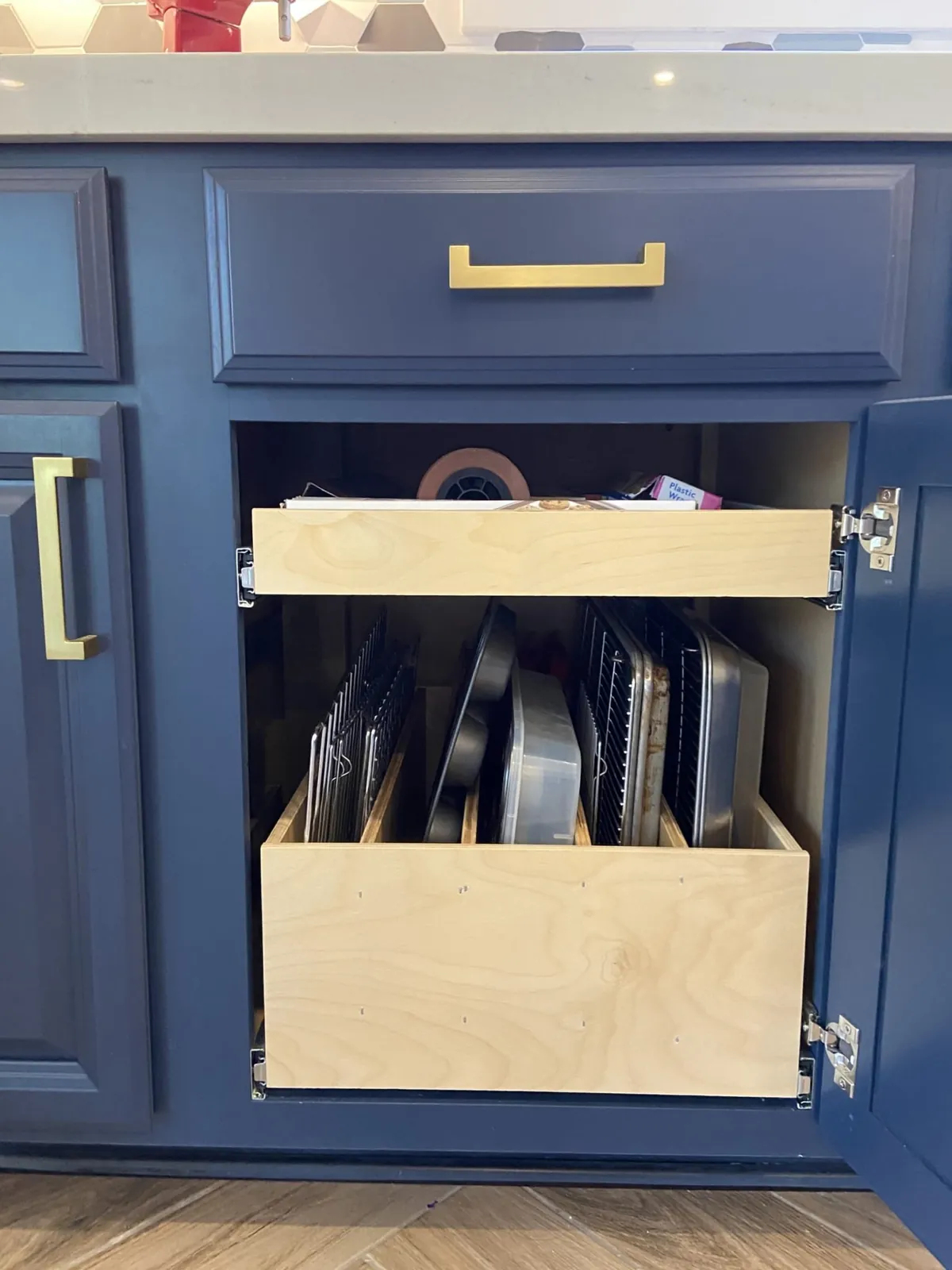 Navy base drawer opened on sheet-pan and tray storage